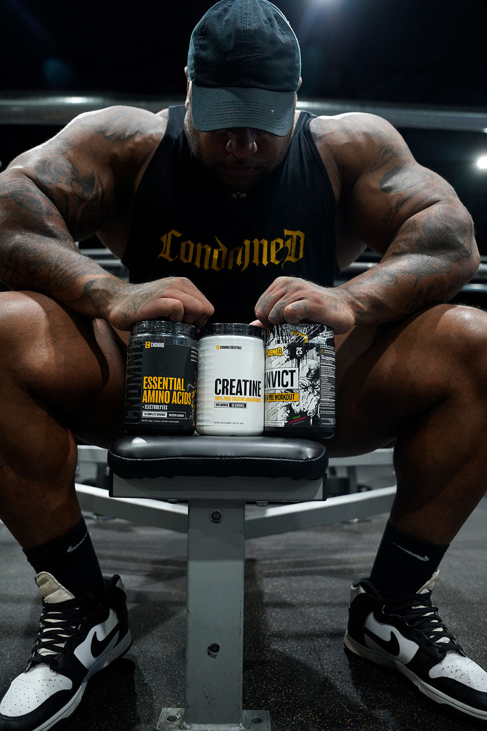 Condemned Labz athlete seated with Essential Amino Acids, Creatine, and Convict